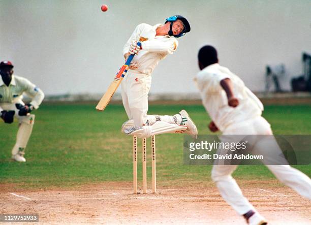 Mike Atherton jumps away from a ball by Courtney Walsh during the 1st test - West Indies v England - at Sabina Park in Kingston Jamaica. 19th...