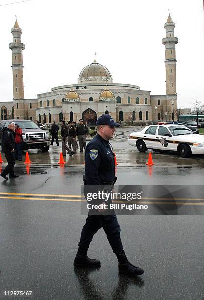 Police guard the Islamic Center of America prior to a planned protest there by Pastor Terry Jones of the Dove World Outreach Center in Gainesville,...