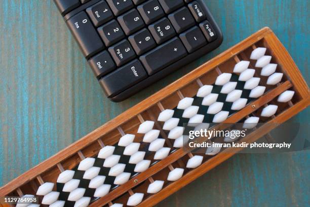 the abacus  and keyboard calculator - accounting abacus stock pictures, royalty-free photos & images