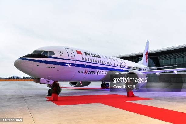 This photo taken on December 15, 2018 shows a Boeing 737 MAX 8 airplane delivered to Air China during a ceremony at Boeing Zhoushan 737 Completion...