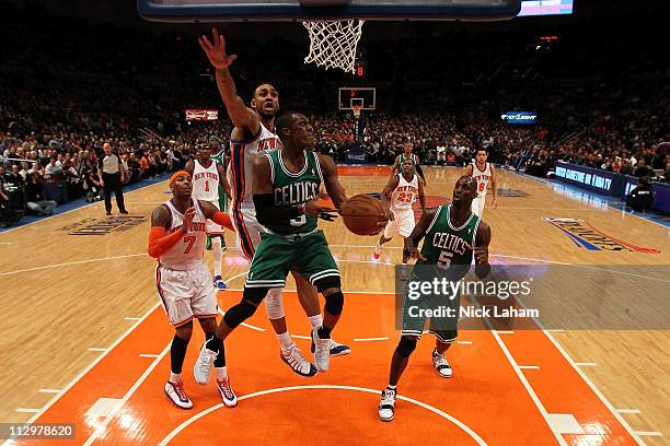 Rajon Rondo of the Boston Celtics drives for a shot attempt against Jared Jeffries of the New York Knicks in Game Three of the Eastern Conference...