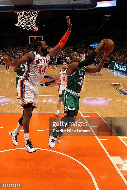 Paul Pierce of the Boston Celtics drives for a shot attempt against Ronny Turiaf of the New York Knicks in Game Three of the Eastern Conference...