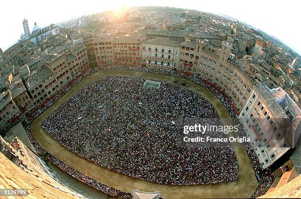 The Piazza del Campo is shown during the "Palio di Siena" July 2, 2002 in Siena, Italy. The medieval horse race and pageant pays homage to the...