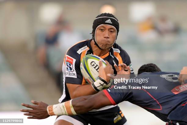 Christian Lealiifano of the Brumbies is tackled during the round one Super Rugby match between the Brumbies and the Rebels at GIO Stadium onon...