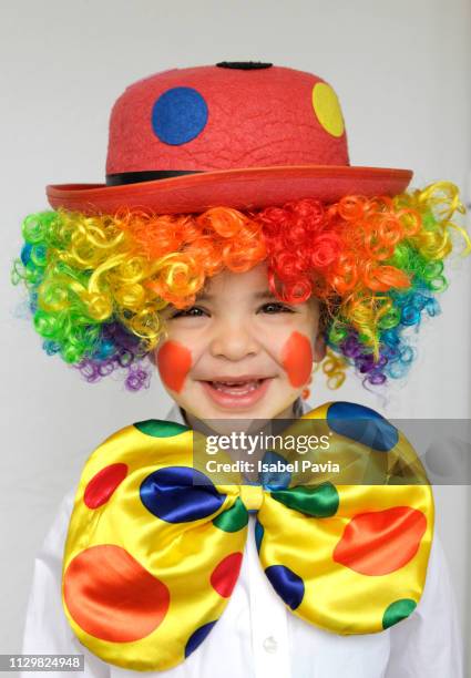 portrait of happy a boy dressed up as a clown - happy clown faces stock-fotos und bilder