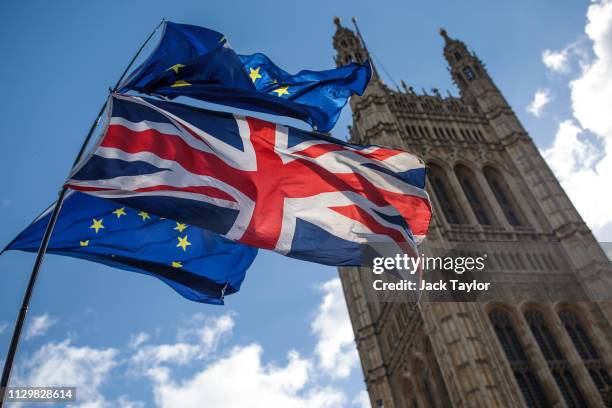 Anti-Brexit protesters demonstrate with flags outside the House of Parliament on March 11, 2019 in London, England. Talks between the UK and the EU...