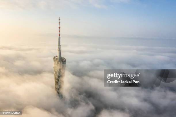 aerial view of guangzhou canton tower in fog - guangzhou stock pictures, royalty-free photos & images