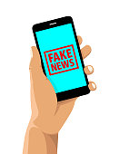 Fake news rubber stamp on a cell phone
