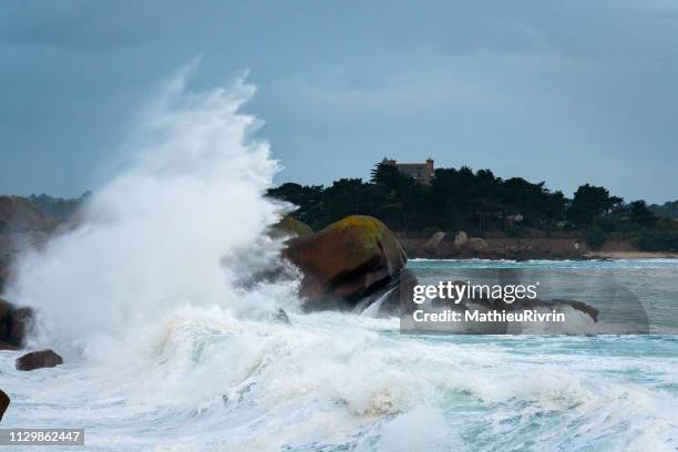storm in ploumanach and the "cote de granite rose" - impression forte stock pictures, royalty-free photos & images