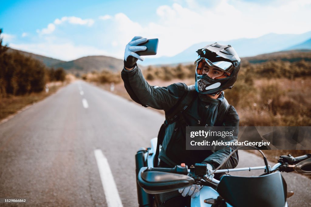 Motorcyclist Taking A Selfie After a Ride