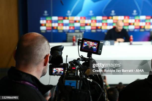 Television camera films Pep Guardiola the head coach / manager of Manchester City during the Manchester City Press Conference & Training Session...