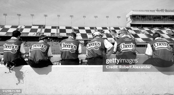 Members of Richard Petty's race crew sit on the pit road wall during qualifying for the 2005 Daytona 500 at Daytona International Speedway in Daytona...