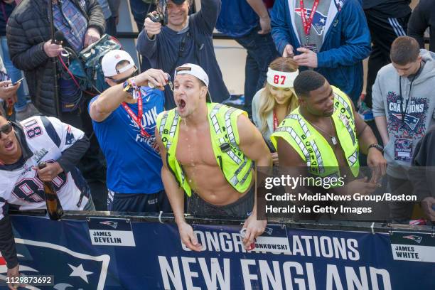 February 4, 2019: Wearing a Boston Police vest, New England Patrito Rob Gronkowski drinks a beer during the New England Patriots Super Bowl LIII...