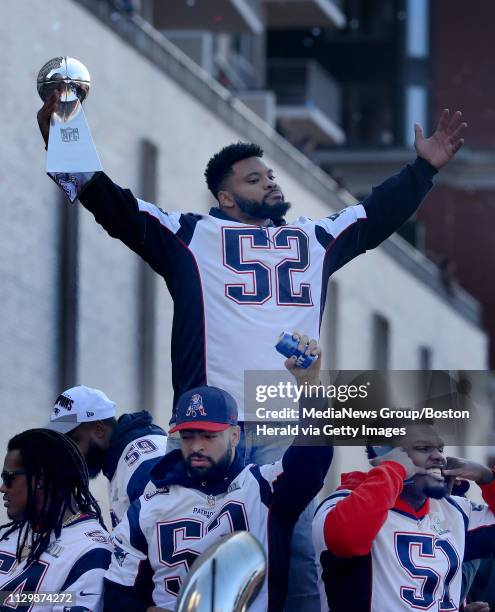 Elandon Roberts of the New England Patriots celebrates with the Lombardi trophy during the team's victory parade after winning Super Bowl LIII on...