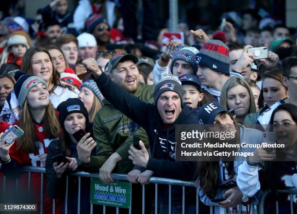 Fans celebrate during the New England Patriots victory parade after the team won Super Bowl LIII on February 5, 2019 in Boston, MA.