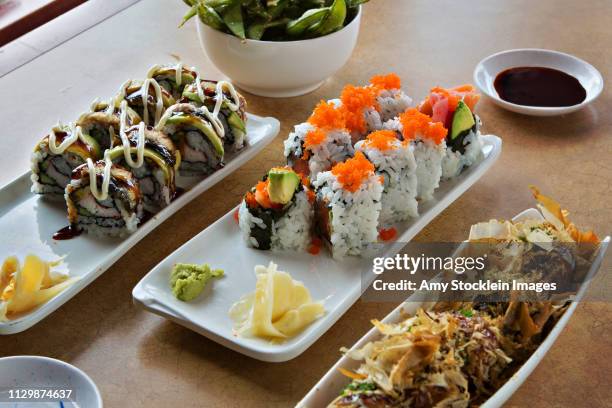 dragon roll, zen roll & takoyaki ball japanese food dishes - ballsaal stockfoto's en -beelden