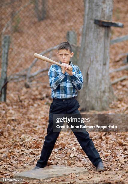 Boy playing baseball, Pike County, Kentucky, US, 1967.