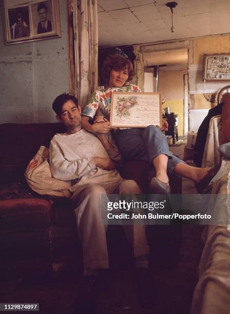 Married couple showing their marriage certificate at their home, Pike County, Kentucky, US, 1967.