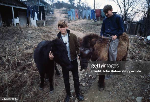 Two boys with ponies, Pike County, Kentucky, US, 1967.