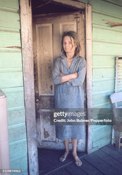 Barefoot woman on the porch of her house, Pike County, Kentucky, US, 1967.