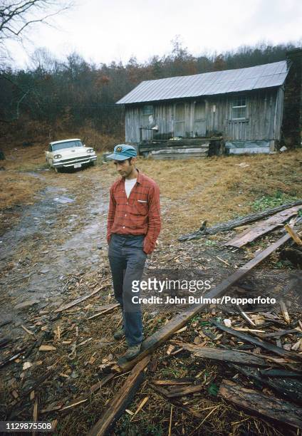 Man outside his log house, Pike County, Kentucky, US, 1967.