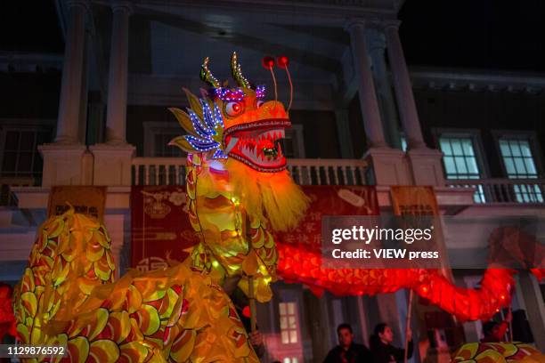 Group of chinese traditional martial arts and dance perform the "Dragon Dance" on the Chinese New Year Bicultural Celebration in The relations...