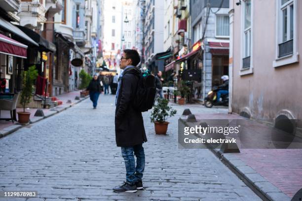 mid adult traveler exploring istanbul on foot - şişli ストックフォトと画像
