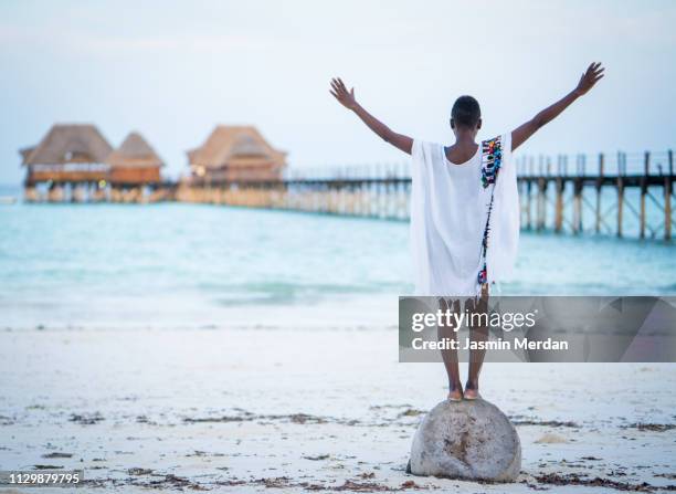 young black woman on tropical beach - luxury hotel island stock pictures, royalty-free photos & images