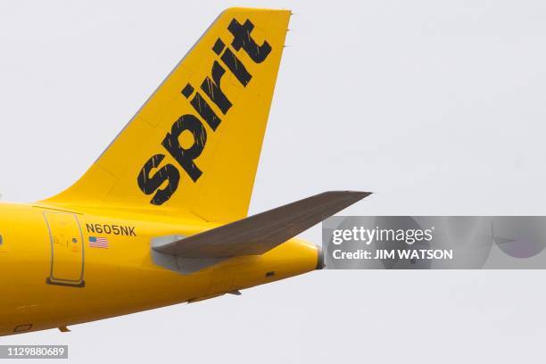 The tail section of an Airbus 320 operated by Spirit Airlines is seen as it approaches for landing at Baltimore Washington International Airport near...