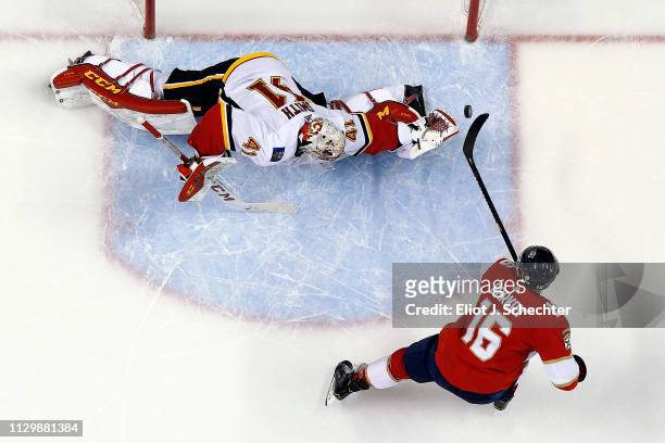Aleksander Barkov of the Florida Panthers scores in a shoot out against Goaltender Mike Smith of the Calgary Flames at the BB&T Center on February...