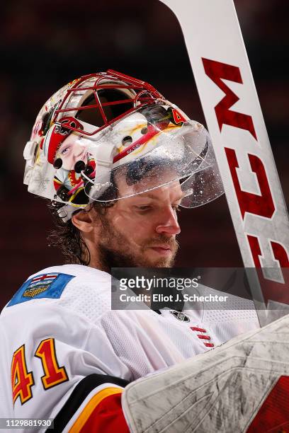 Goaltender Mike Smith of the Calgary Flames heads back to the net after a break in the action against the Florida Panthers at the BB&T Center on...