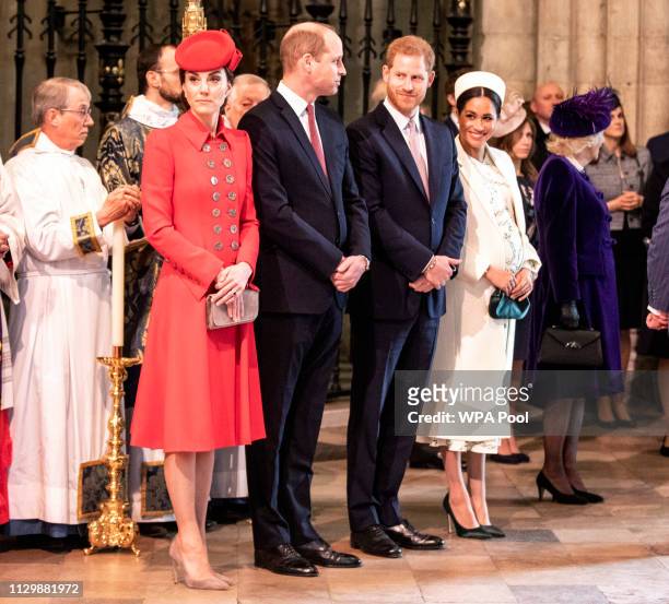 The Duke and duchess of Cambridge stand with the duke and Meghan, Duchess of Sussex at Westminster Abbey for a Commonwealth day service on March 11,...