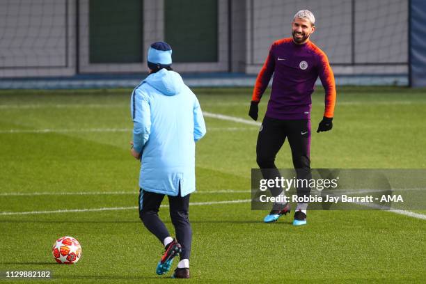 Pep Guardiola the head coach / manager of Manchester City and Sergio Aguero of Manchester City during the Manchester City Press Conference & Training...