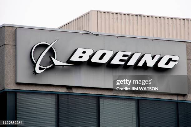 The Boeing Company logo is seen on a building in Annapolis Junction, Maryland, on March 11, 2019. - Tumbling shares in US aviation giant Boeing on...