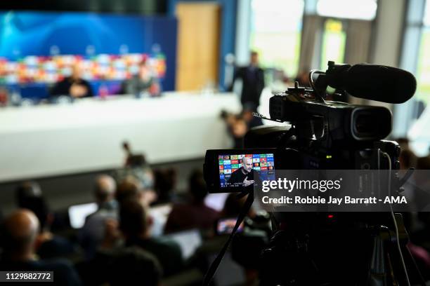 Television camera films Pep Guardiola the head coach / manager of Manchester City during the Manchester City Press Conference & Training Session...