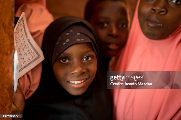 Muslim girls reading Koran