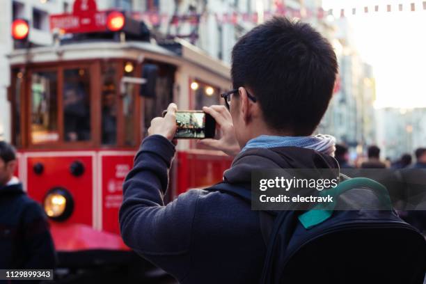 traveler exploring his destination - taksim square stock pictures, royalty-free photos & images