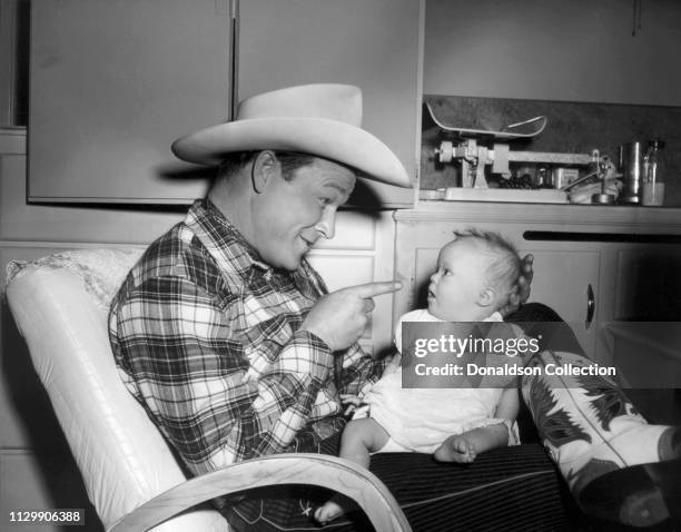 Entertainer Roy Rogers with his daughter Robin Elizabeth Rogers in 1957.