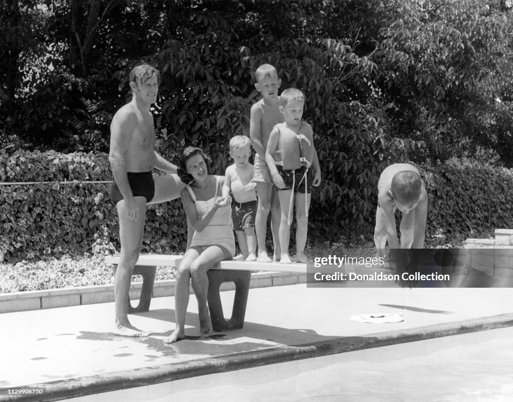 Liz Riddell Actor Chuck Connors by the pool with his wife Elizabeth Jane Riddell ...