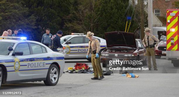 Police and emergency responders work at the scene of a shooting in the 600 Block of Washington Road in Westminster Monday morning, March 11, 2019.