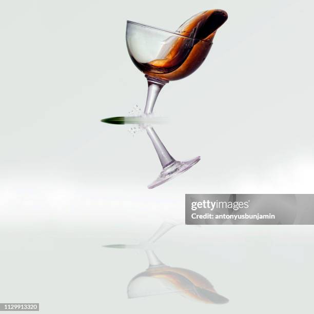 bullet breaking the stem of a wine glass - bullet speeding stock pictures, royalty-free photos & images