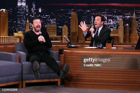 Comedian Ricky Gervais and host Jimmy Fallon during "Singing In The