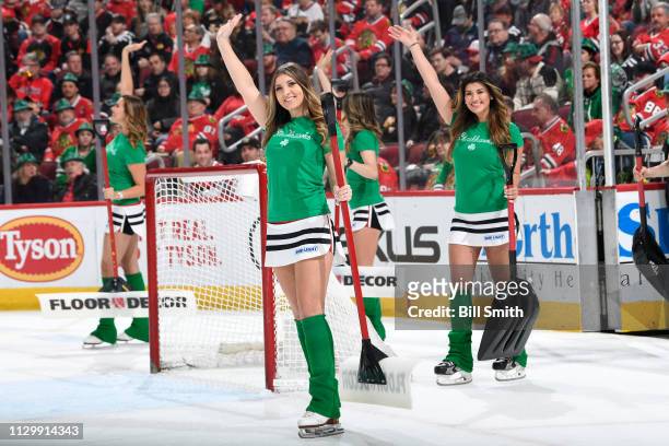 Members of the Chicago Blackhawks ice-crew wave to the crowd in the first period between the Chicago Blackhawks and the Arizona Coyotes at the United...