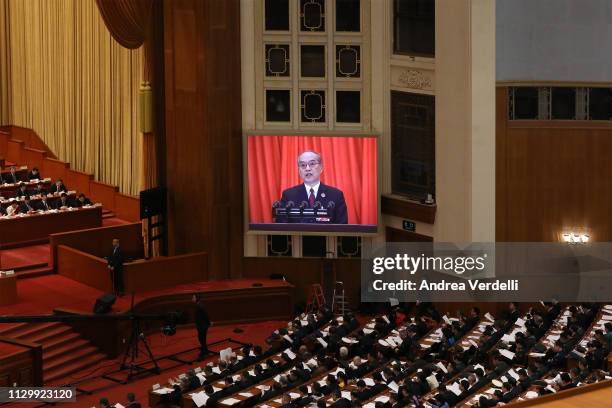 Deputies of the National People's Congress listen to Procurator-General of the Supreme People's Procuratorate Zhang Jun's speech on the work of the...