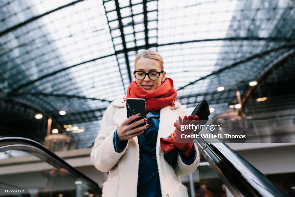 Businesswoman Texting On Way To The Office