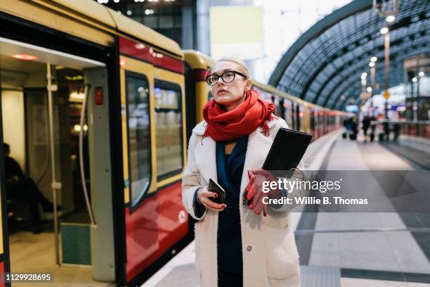 businesswoman waiting for train - waiting stock-fotos und bilder
