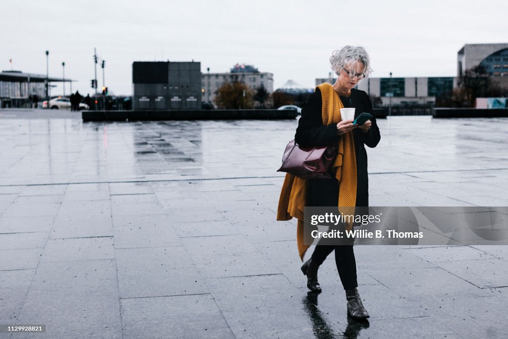 Businesswoman Walking With Coffee