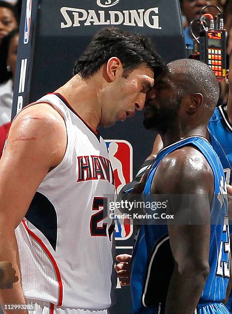 Zaza Pachulia of the Atlanta Hawks headbutts Jason Richardson of the Orlando Magic during Game Three of the Eastern Conference Quarterfinals in the...