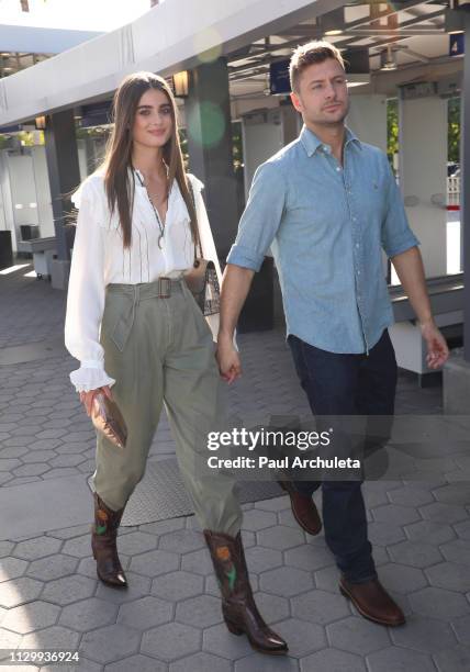 Model Taylor Hill and Michael Stephen visit the set of 'Extra' at Universal Studios Hollywood on January 24, 2019 in Universal City, California.