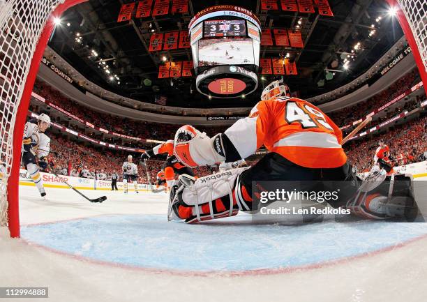 Tyler Ennis of the Buffalo Sabres scores the game winning goal in overtime against Michael Leighton of the Philadelphia Flyers in Game Five of the...